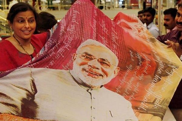  Modi Sarees is the latest trend after wedding cards, gold and silver bars, Rakhis, t-shirts and mugs across the nation. (@NooraniTejani/Twitter)