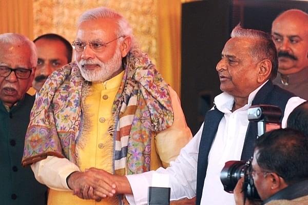 PM Narendra Modi and Samajwadi Party strongman Mulayam Singh Yadav. (Ashok Dutta/Hindustan Times via Getty Images)