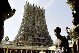 A devotee walks past the entrance to the Meenakshi temple in
Madurai (DIBYANGSHU SARKAR/AFP/GettyImages)
