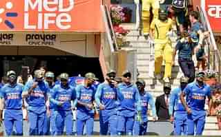 Indian cricket team wearing military camouflage caps during an ODI against Australia (Pic: twitter)