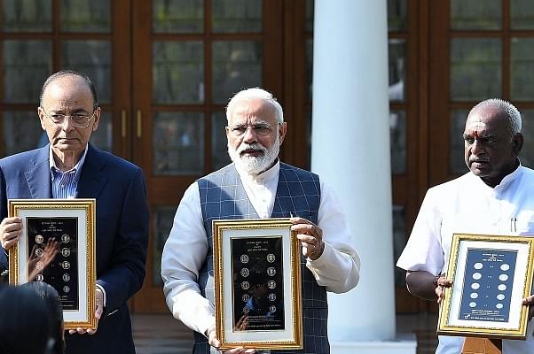 Prime Minister, Shri Narendra Modi releasing the new series of visually impaired friendly circulation coins, at a function, at 7 Lok Kalyan Marg, New Delhi on 7 March 2019 (PIB/PMO)