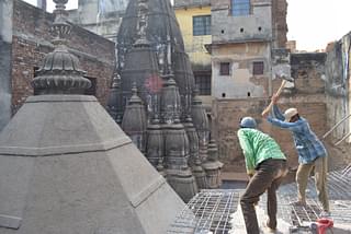 Care is being taken to manually break the encroachments structurally&nbsp; attached to the temple.