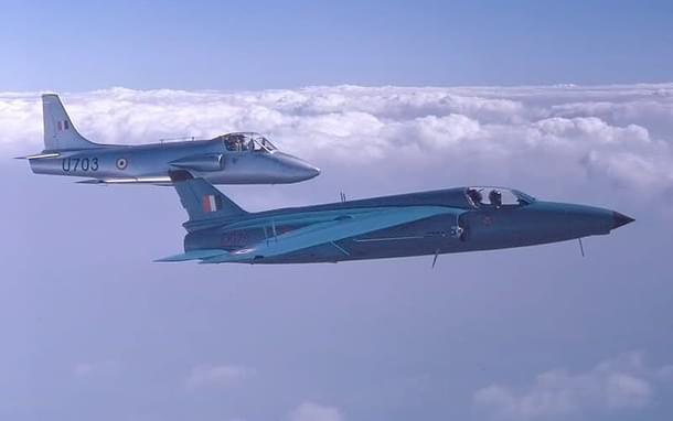 Gnat (dark blue) of the IAF in formation with HAL Kiran (silver) over the skies of Farnborough, United Kingdom, in the September of 1972 . 