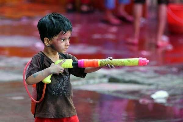 A boy plays Holi Sion in Mumbai. (Kunal Patil/Hindustan Times via GettyImages)