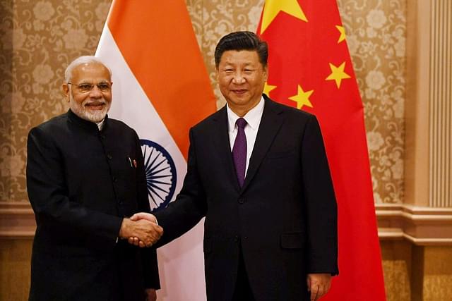 PM Narendra Modi  with Chinese President Xi Jinping in Johannesburg on the sidelines of BRICS Summit. Image courtesy of twitter.com/MEAIndia.
