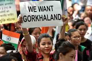 A girl holds a placard during the ongoing Gorkhaland protests (Ravi Choudhary/Hindustan Times via Getty Images)