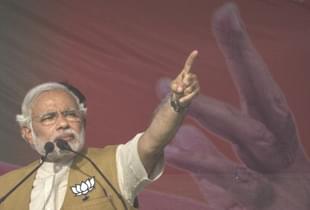 Prime Minister Narendra Modi gestures while speaking to the crowd at a rally in Sidhuali, near Lucknow, India. (Kevin Frayer/Getty Images)