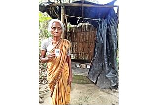 Kamaleshwari Barman in front of her toilet (Credit: Abir Bhattacharjee)&nbsp;