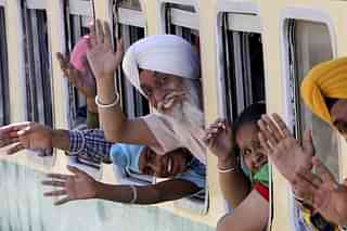 Indian Sikh pilgrims arrive at Wagah railway station in Pakistan, Friday to attend their religious festival. (PTI Photo) &nbsp;
