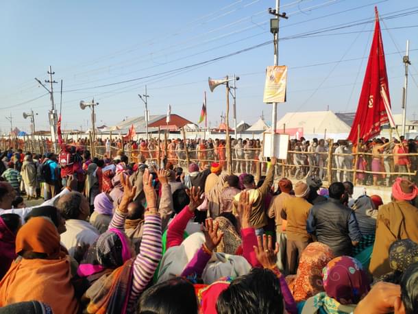 Kumbh mela visitors watch as sadhus head for the dip (Photo: Chinmay Hegde)