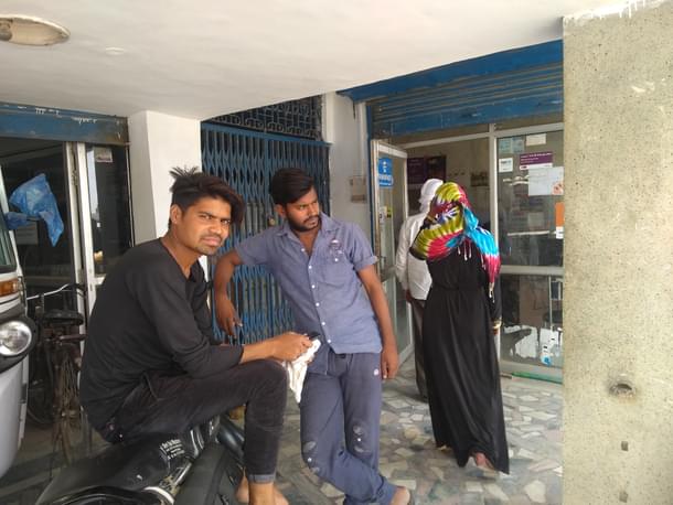 Parvez and Javed standing outside the Western Union outlet. (Prakhar Gupta/Swarajya)