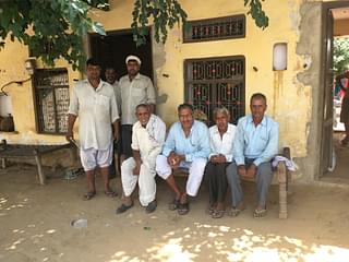 Villagers in Mainaki (Mahavir and Suresh are one sitting on the left side of the cot)