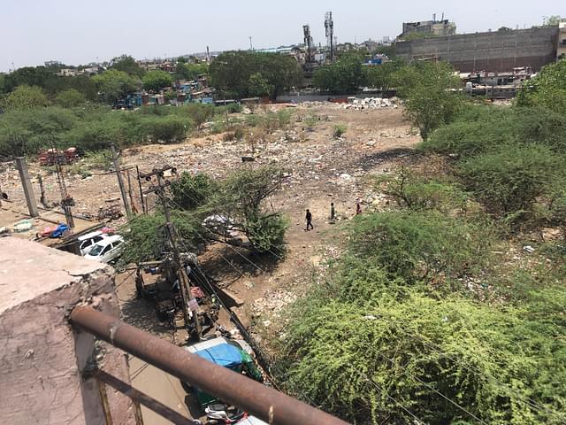 View from Gupta’s terrace that shows the vacant plot