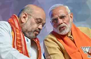 BJP president Amit Shah with Prime Minister Narendra Modi during a meeting. (Getty Images)