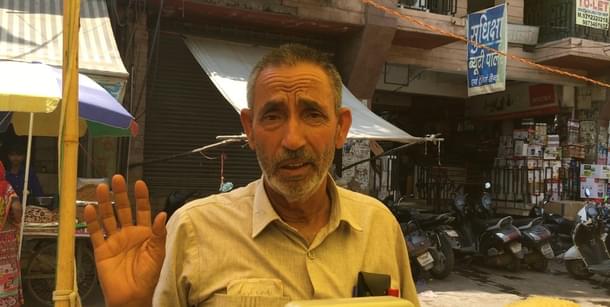 Nausheer Ahmed sells dates outside Jama Masjid.