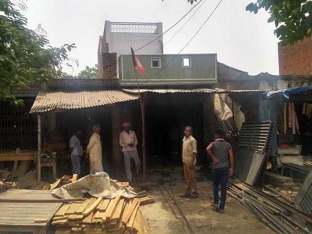 The iron workshop with a BJP flag at its entrance. (Prakhar Gupta/Swarajya)
