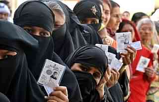 Muslim women outside a polling station.