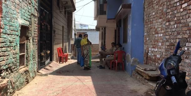 Police keeping a vigil outside the house of the Yadav family.