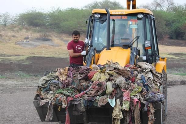 Cleaning up waste from river Bhima in Ganagapura after election victory.