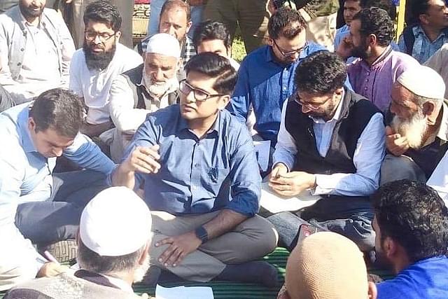 Owais Ahmad, DM of Shopian, sitting among common people as part of ‘Back To Village” program (Source: @owais_ias/Twitter)