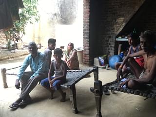  Harswaroop (right) with his family in neighbouring village of Peepli Umarpur.