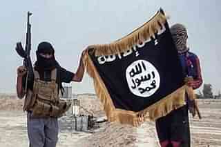 ISIS terrorists holding their flag. (File Photo)