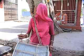 A woman wearing the ghunghat