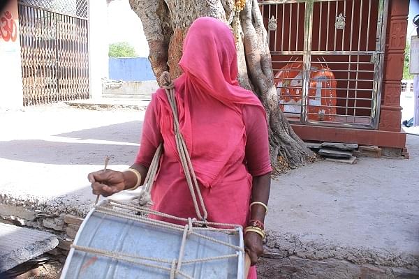 A woman wearing the ghunghat