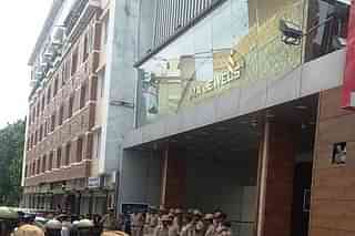 Police presence outside IMA Jewels shop in Shivajinagar