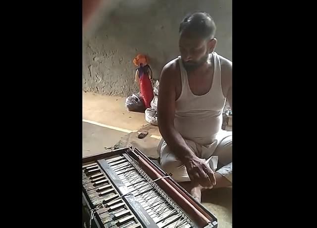 Dilsher Khan with his damaged harmonium.