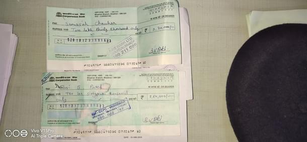 Some cheques handed to farmers by the gang