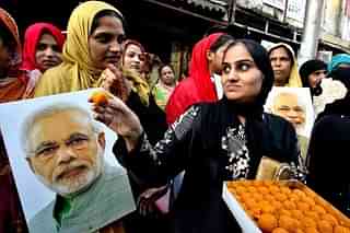 Muslim women with PM Modi's image
