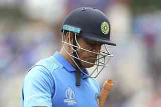 Mahendra Singh Dhoni leaves the field after being given run-out during the semi-final match against New Zealand.