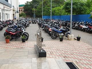 The two-wheeler parking lot is chock-a-bloc with vehicles of  commuters who avail monthly passes.