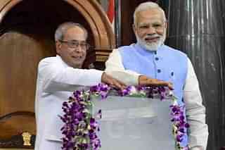 Prime Minister Narendra Modi and former president launch GST in the central hall of Parliament.