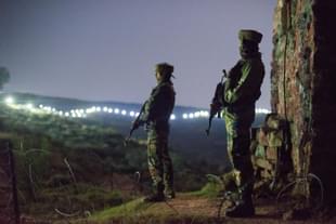 Indian Army soldiers at forward posts beyond the illuminated fence. (Representative Image) (Gurinder Osan/Hindustan Times via Getty Images) 
