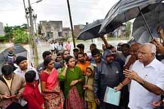 Karnataka CM B S Yediyurppa interacting with flood victims (@BSYBJP/Twitter)