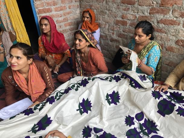 Women with their embroidery work.