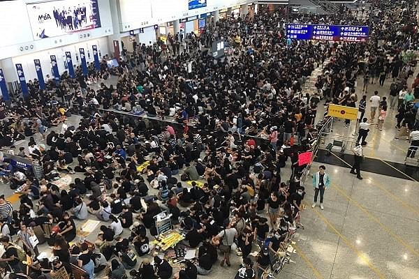 Thousands of pro-democracy protesters entered the arrival halls of the Hong Kong International Airport with signs reading “Hong Kong is not safe”, “Shame on Police”. (Representative Image) (@Fight4HongKong/Twitter)