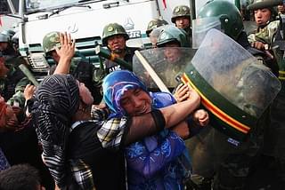 Uighur women clashing with Chinese police during a protest (Representative Image) (@ShimonLevit/Twitter)