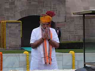 PM Modi at Raj Ghat before the speech. (via Twitter)