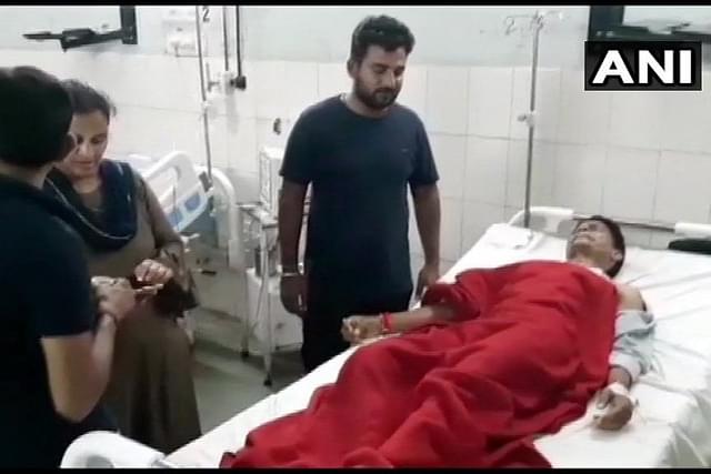 RSS worker Sandeep Gupta has been hospitalised after the attack (@ANI/Twitter)
