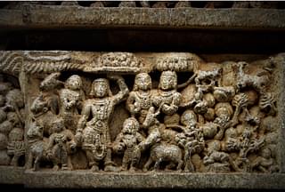 Govardhandhari: Sri Krishna lifts the mountain to protect the cowherds from the fury of Indra. Indra is humbled.