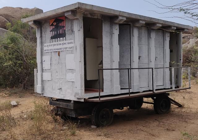 A mobile toilet unit of the Hampi World Heritage Area Management Authority, Hospete that lies abandoned and unfit for use in Hampi