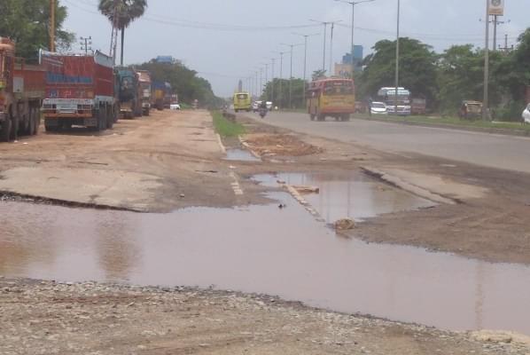 A National Highway in the district ravaged by rain. Note the absence of service roads here as well. 