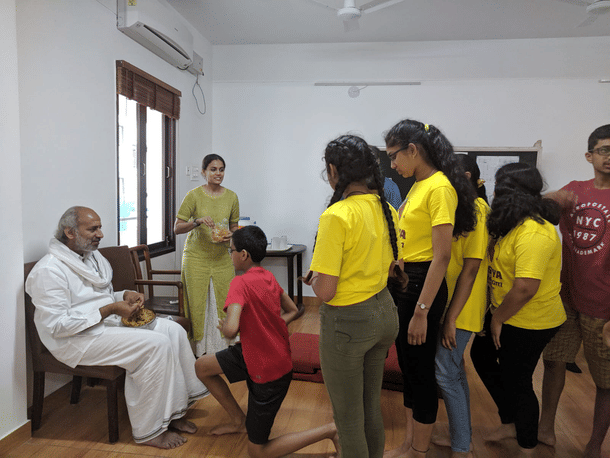 Children interacting with their mentor.
