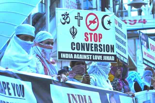 Women associated with India Against Love jihad hold placards and form a human chain to protest against love jihad and conversion to Islam. (Mujeeb Faruqui/Hindustan Times via GettyImages)&nbsp;