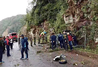 Rescue operation personnel at the site of the crash
