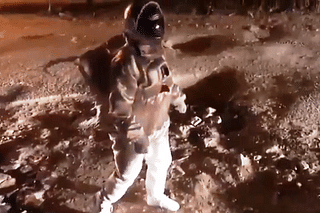 Video screengrab of artist walking on a lunar surface like Bengaluru road