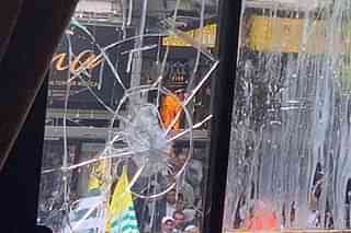 A window of the high commission vandalised by Pakistani protesters (@HCI_Londo/Twitter)